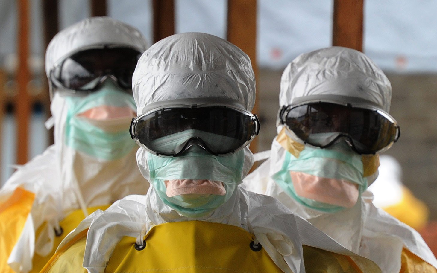 Health care workers, wearing protective suits, leave a high-risk area at the French NGO Medecins Sans Frontieres (Doctors without borders) Elwa hospital on August 30, 2014 in Monrovia. Liberia has been hardest-hit by the Ebola virus raging through west Africa, with 624 deaths and 1,082 cases since the start of the year. AFP PHOTO / DOMINIQUE FAGET (Photo credit should read DOMINIQUE FAGET/AFP/Getty Images)