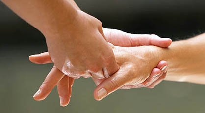 Women's Hand Being Massaged --- Image by © Royalty-Free/Corbis